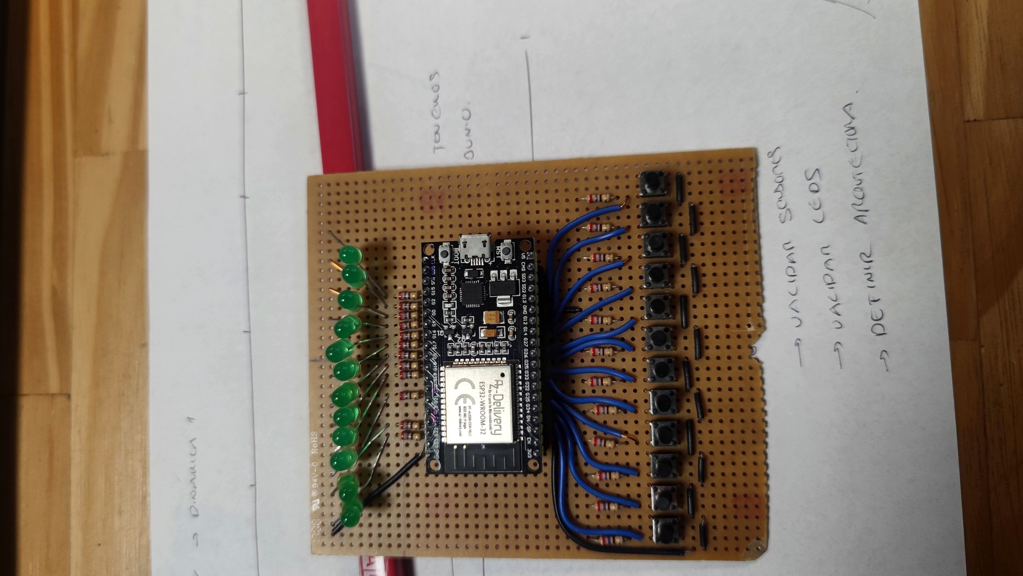 Perfboard with ESP32, green LEDs on one side and tactile buttons on the other